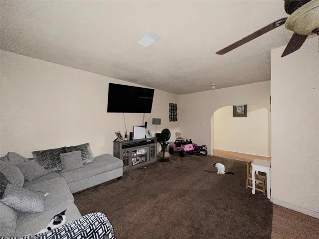 a bedroom with furniture and a baby crib