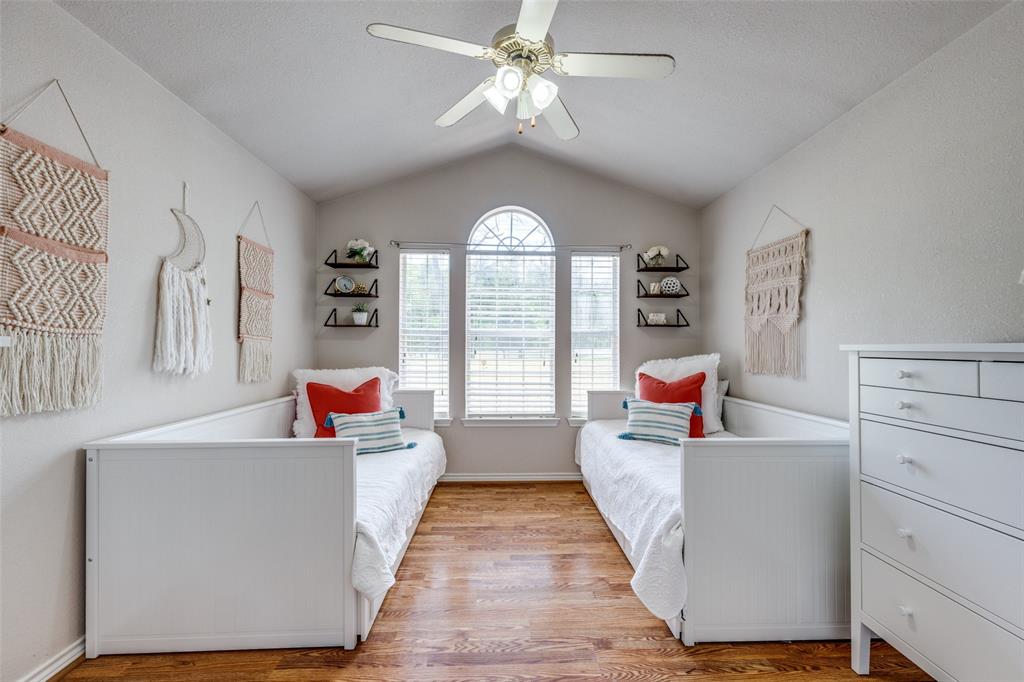 4942 Highway 69 Denison, TX 75021 - Photo 17 of 27 Secondary bedroom #1 has vaulted ceiling, wood floors and plenty of space.