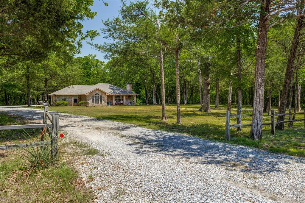 4942 Highway 69 Denison, TX 75021 - Photo 2 of 27 Long private drive leading to your new home sitting on 3.677 acres!