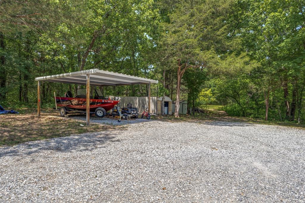 4942 Highway 69 Denison, TX 75021 - Photo 25 of 27 Separate carport provides additional parking to the two car attached garage.