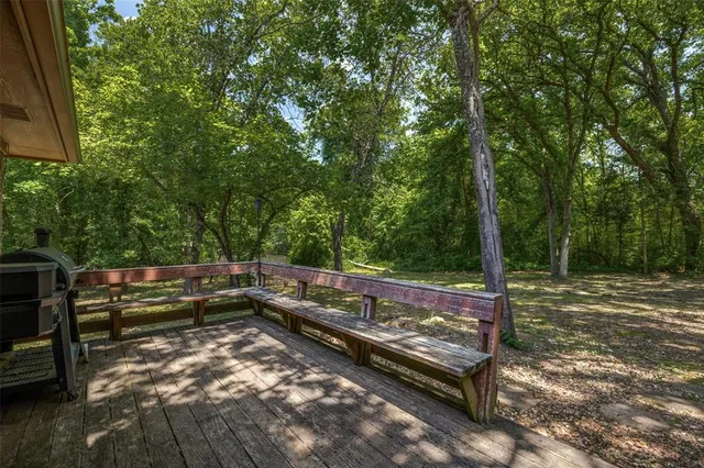 a view of a bench in a backyard
