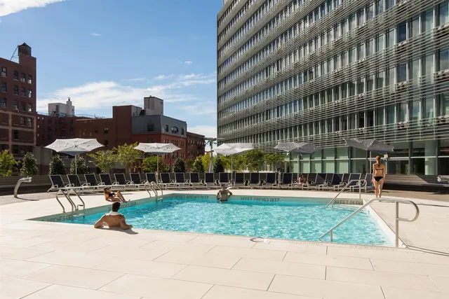 a group of cars parked in front of brick building
