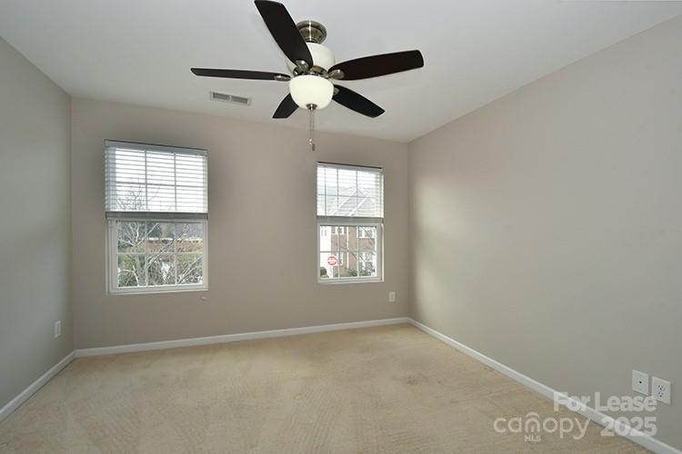 8204 Viewpoint Lane Cornelius, NC 28031 - Photo 13 of 27 a view of an empty room with a window
