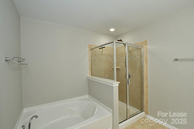 8204 Viewpoint Lane Cornelius, NC 28031 - Photo 19 of 27 a bathroom with a shower and a tub
