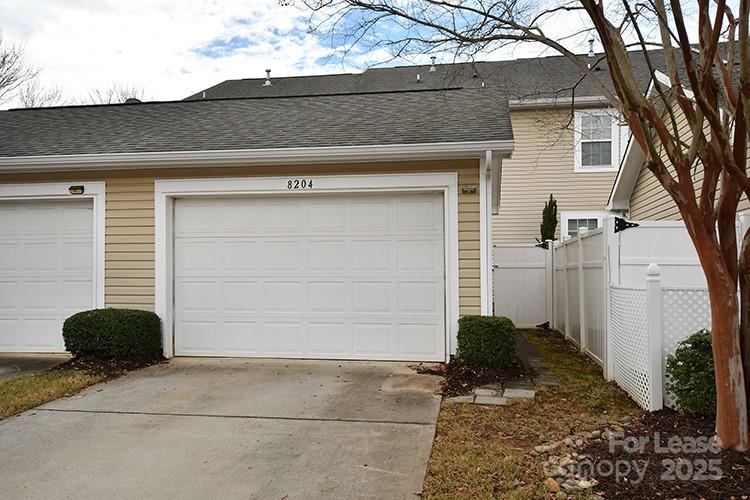 8204 Viewpoint Lane Cornelius, NC 28031 - Photo 23 of 27 a view of backyard of house and garage