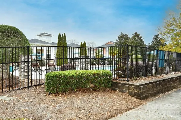 a view of a wrought iron fences in front of house