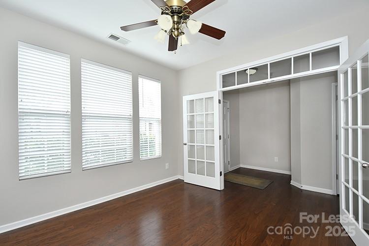 8204 Viewpoint Lane Cornelius, NC 28031 - Photo 3 of 27 a view of an empty room with a window and wooden floor