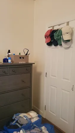 a bedroom with a bed and cabinets