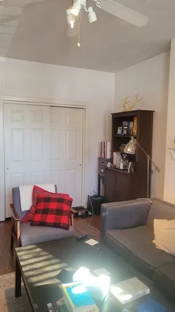 a bedroom with a bed and chandelier