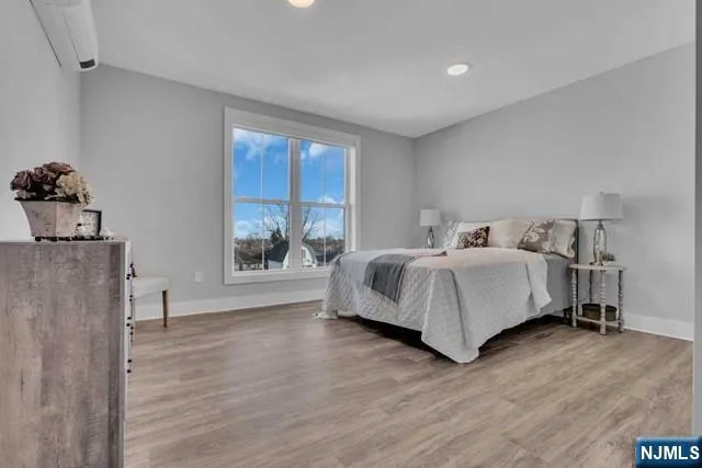 a bed room with a bed and a window