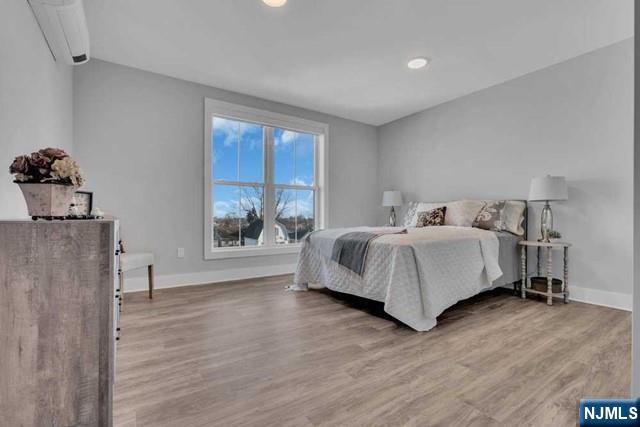 108 Ridge Road, Unit 302 North Arlington, NJ 07031 - Photo 12 of 15 a bed room with a bed and a window