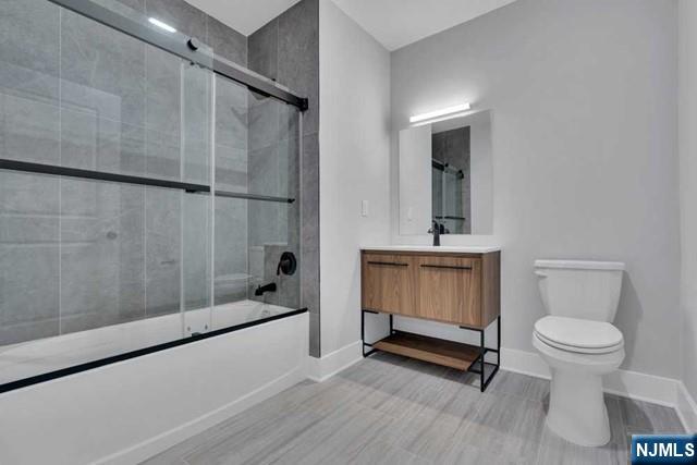 108 Ridge Road, Unit 302 North Arlington, NJ 07031 - Photo 15 of 15 a bathroom with a sink a toilet and shower