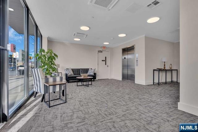 108 Ridge Road, Unit 302 North Arlington, NJ 07031 - Photo 2 of 15 a view of a livingroom with furniture and a potted plant