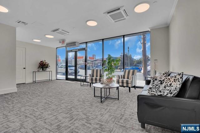 108 Ridge Road, Unit 302 North Arlington, NJ 07031 - Photo 3 of 15 a living room with furniture and a large window