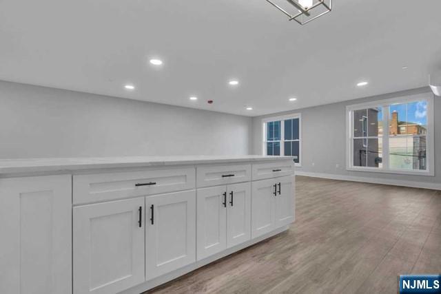 108 Ridge Road, Unit 302 North Arlington, NJ 07031 - Photo 10 of 15 a spacious bathroom with a granite countertop sink and a mirror