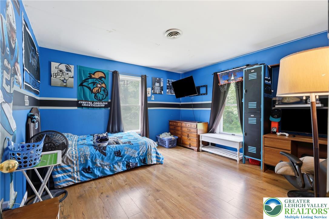 732 Bushkill Center Road Nazareth, PA 18064 - Photo 15 of 43 Laminate flooring and well-lit interiors define this versatile bedroom space.