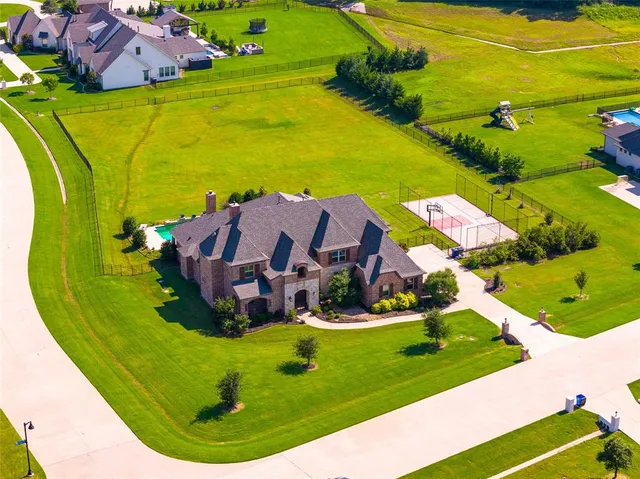 a view of a swimming pool with a yard
