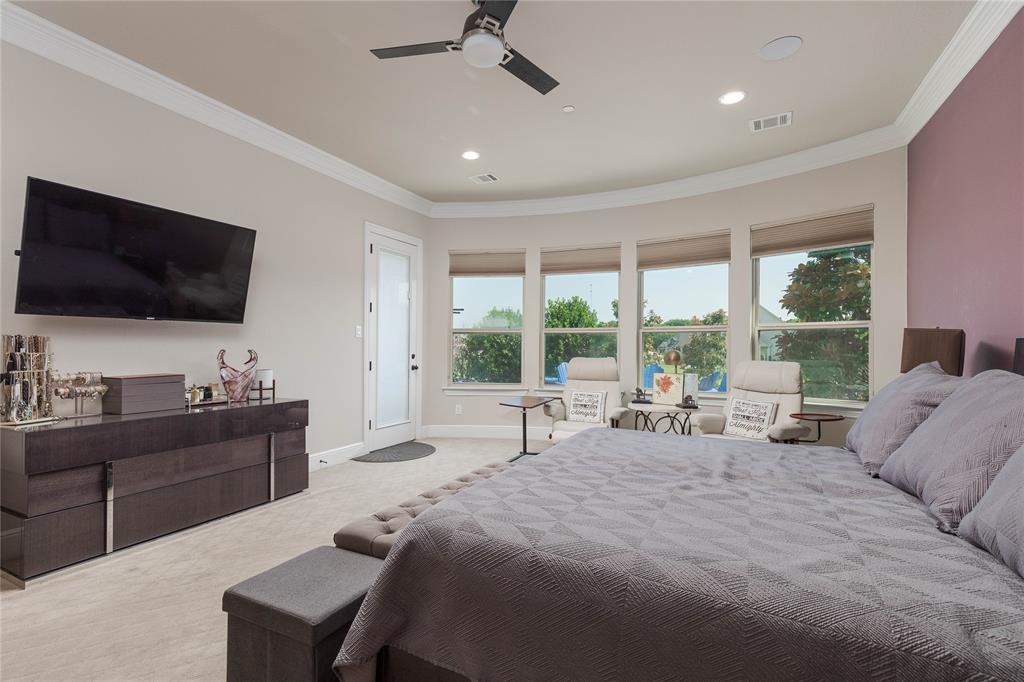 835 Bentwater Lucas, TX 75002 - Photo 11 of 40 a spacious bedroom with a large bed and a flat screen tv