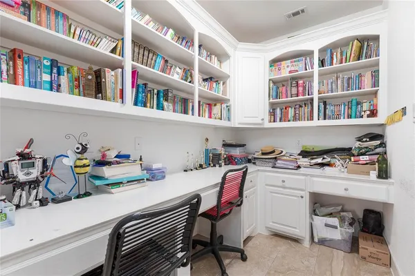 a view of a workspace with furniture and toys