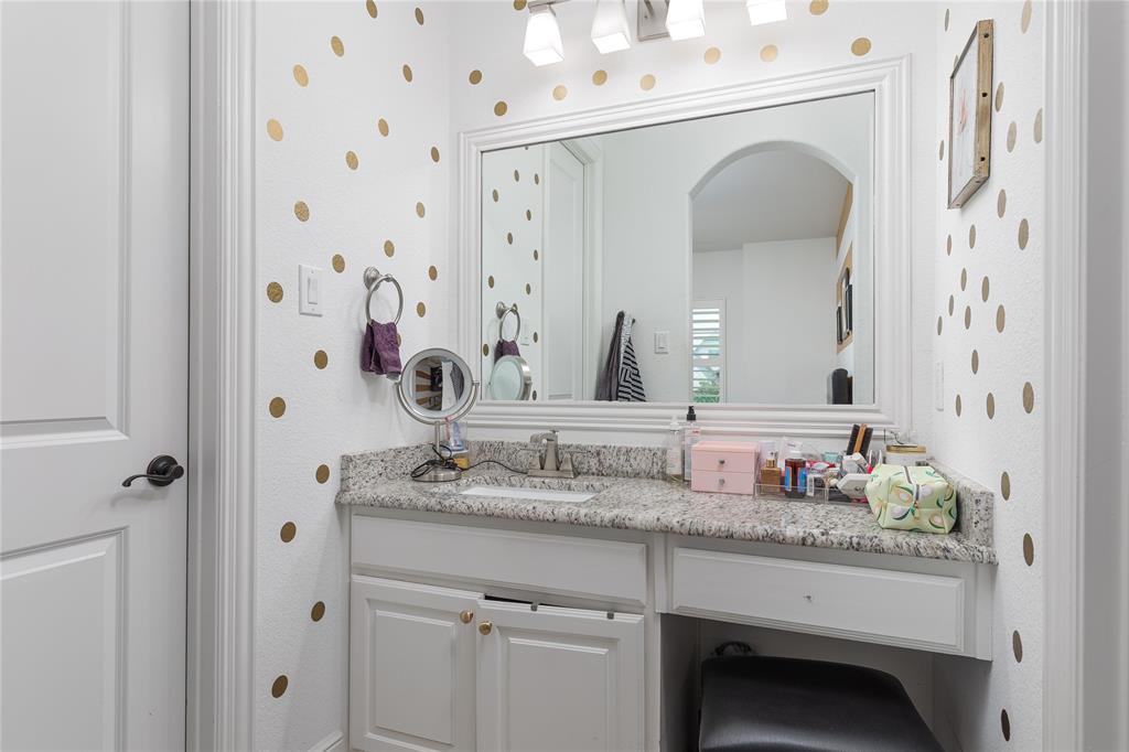 835 Bentwater Lucas, TX 75002 - Photo 27 of 40 a bathroom with a granite countertop sink and a mirror