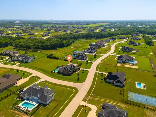 an aerial view of a pool yard and outdoor seating