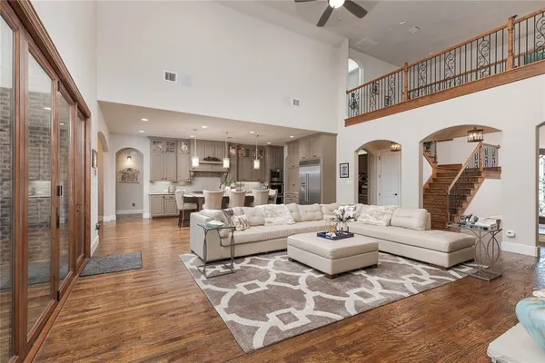 a living room with furniture fireplace and a chandelier