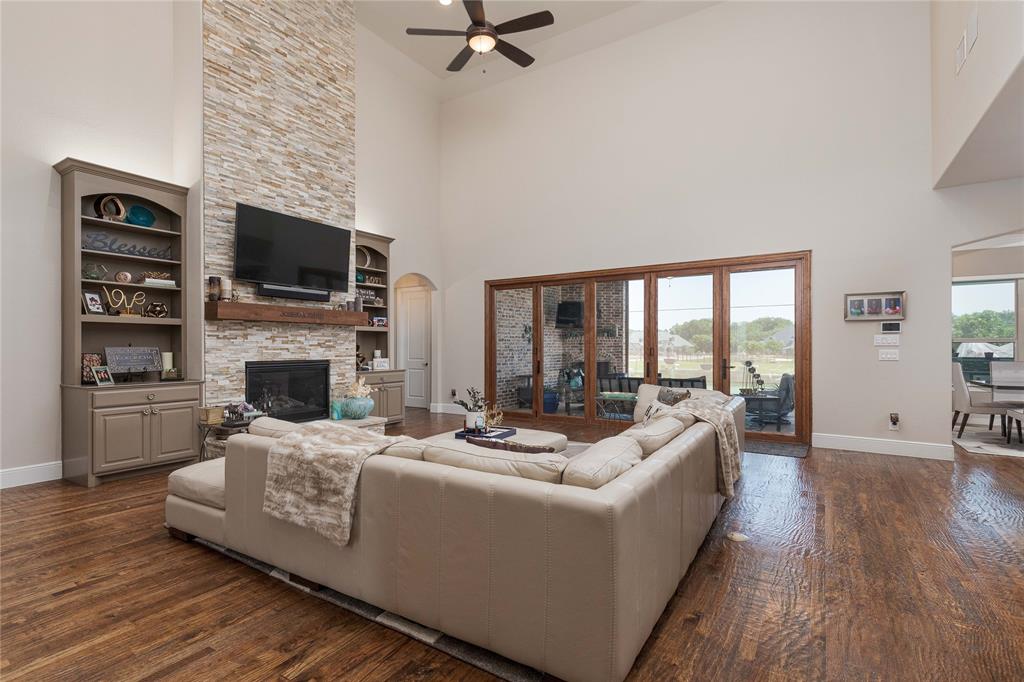 835 Bentwater Lucas, TX 75002 - Photo 5 of 40 a living room with fireplace furniture and a flat screen tv