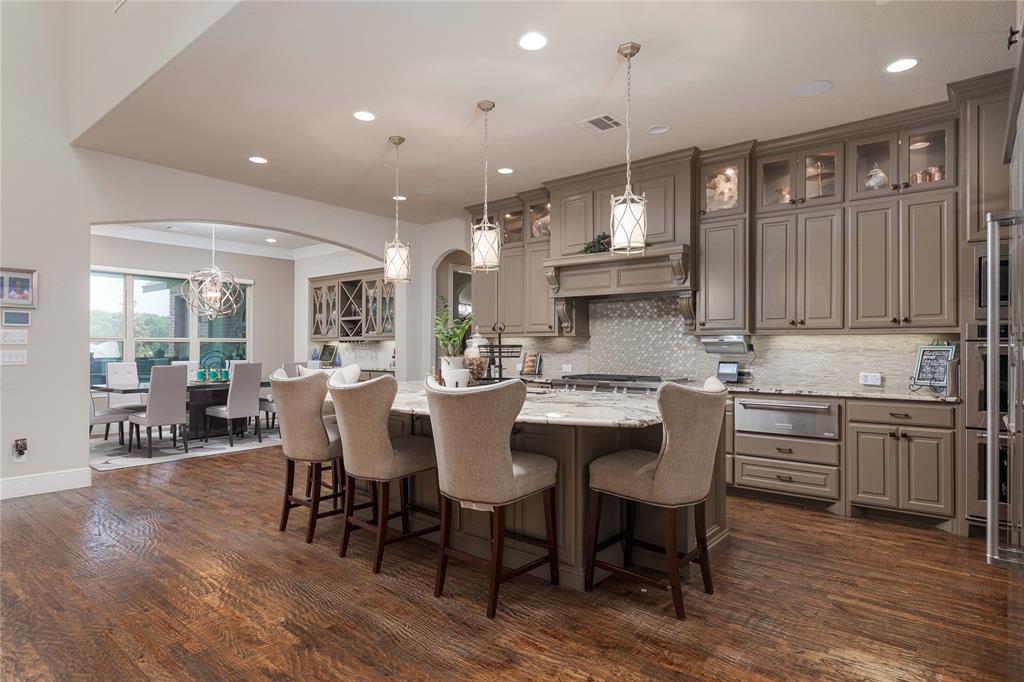835 Bentwater Lucas, TX 75002 - Photo 6 of 40 a large kitchen with a table and chairs