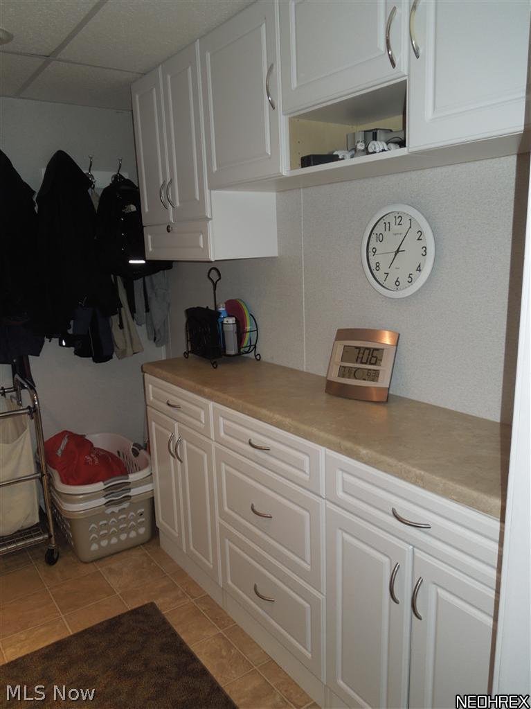 4604 5th Street Northwest Canton, OH 44708 - Photo 19 of 25 The laundry room features lots of cabinet space and plenty of folding area!