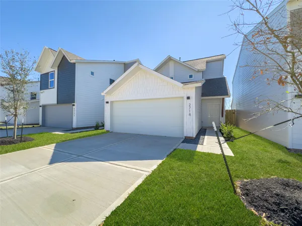 a view of a dining room with furniture wooden floor and chandelier