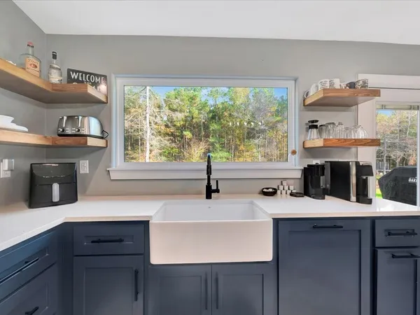 a kitchen with a sink and a window