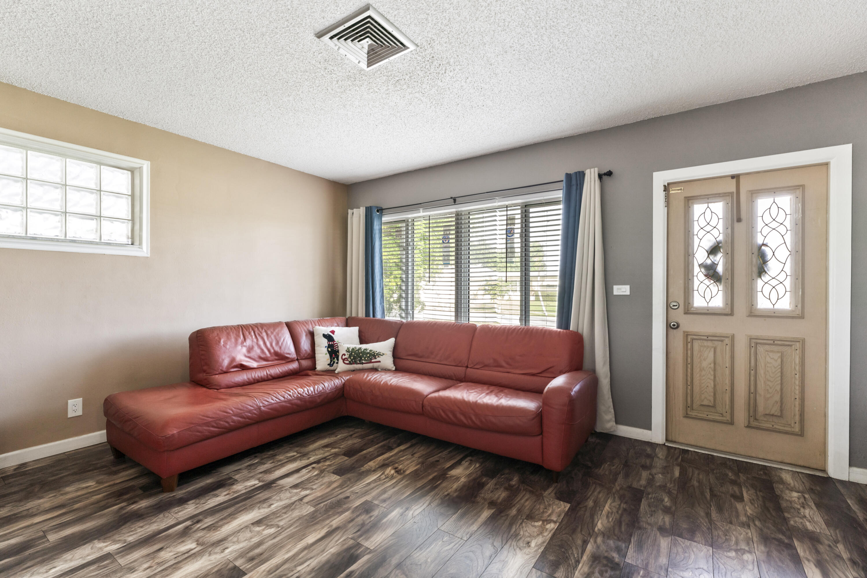 337 East Lake Road Palm Springs, FL 33461 - Photo 1 of 26 a living room with furniture and a window