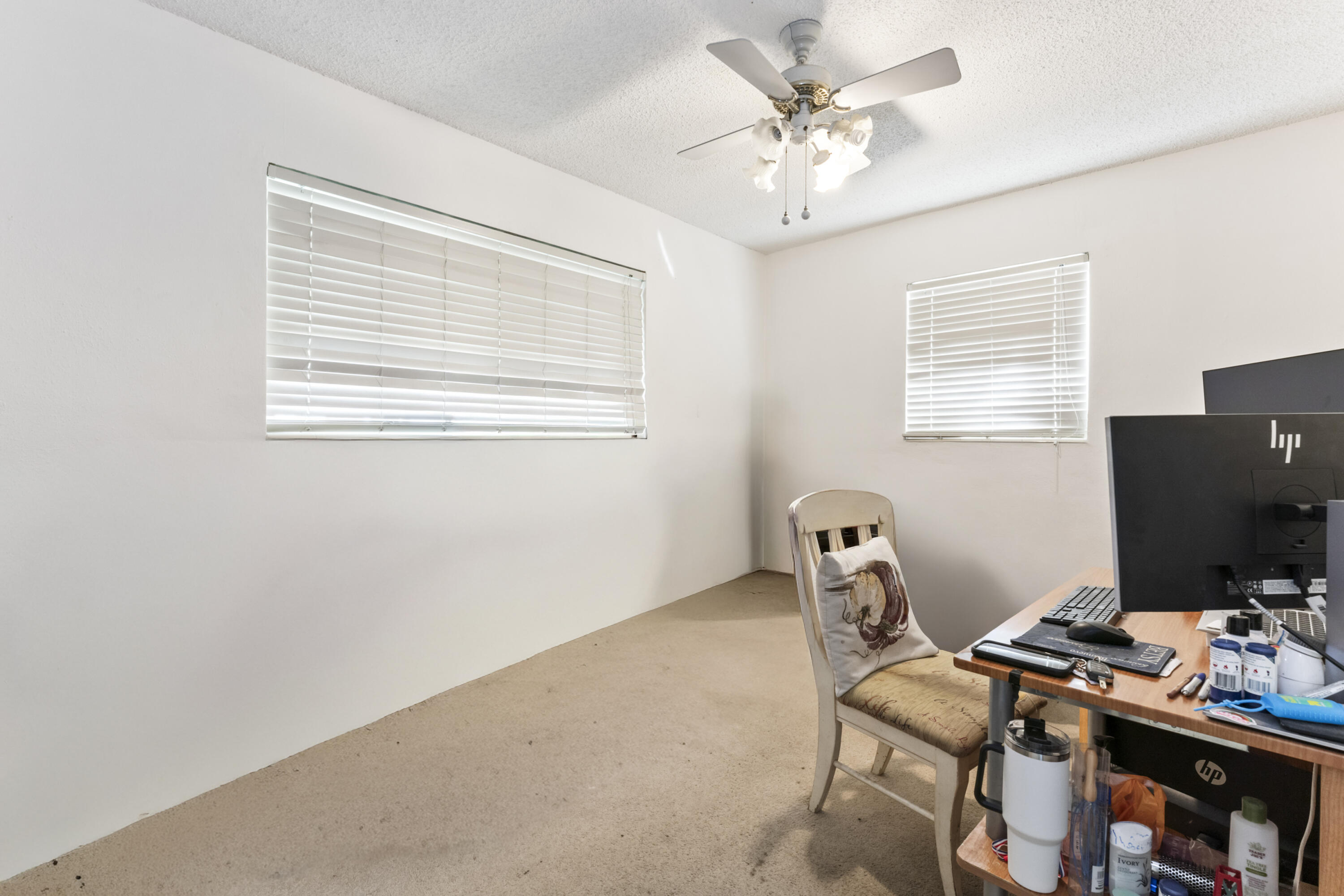 337 East Lake Road Palm Springs, FL 33461 - Photo 13 of 26 a workspace with furniture and a window