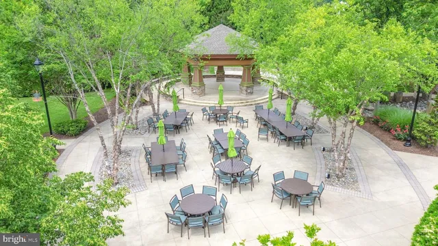 a view of an chairs and table in backyard