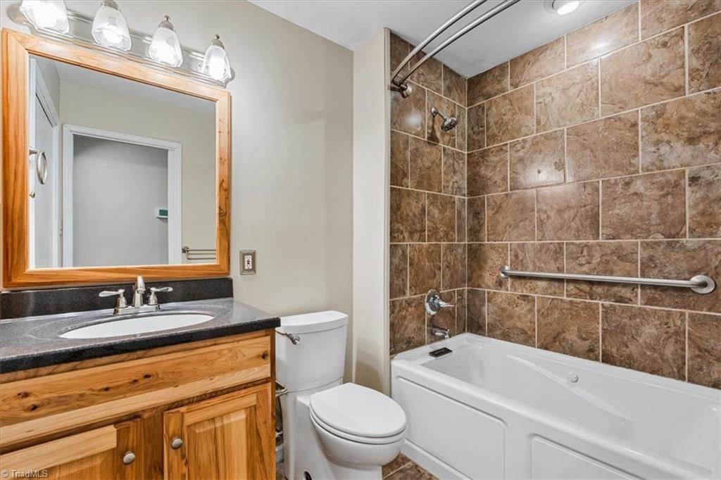 5610 Fleming Terrace Road Greensboro, NC 27410 - Photo 20 of 50 Upstairs hall bath has a stacked washer and dryer