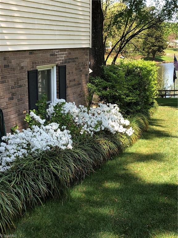 5610 Fleming Terrace Road Greensboro, NC 27410 - Photo 49 of 50 Beautiful flowers adorn the yard