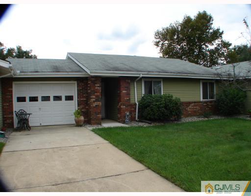 272 B Convent Road Monroe Township, NJ 08831 - Photo 1 of 10 a front view of a house with a garden