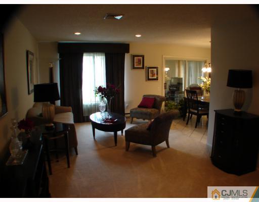 272 B Convent Road Monroe Township, NJ 08831 - Photo 3 of 10 a living room with furniture and a flat screen tv