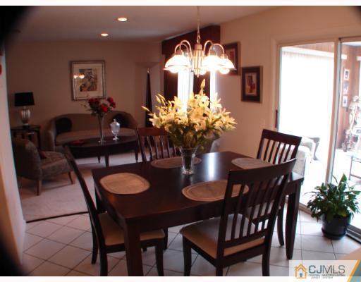 272 B Convent Road Monroe Township, NJ 08831 - Photo 4 of 10 a dining room with furniture and chandelier