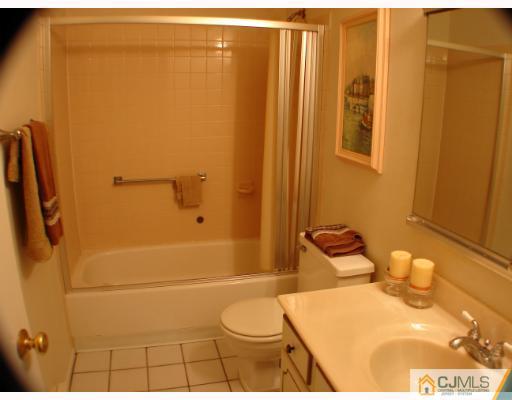 272 B Convent Road Monroe Township, NJ 08831 - Photo 6 of 10 a bathroom with a toilet and shower