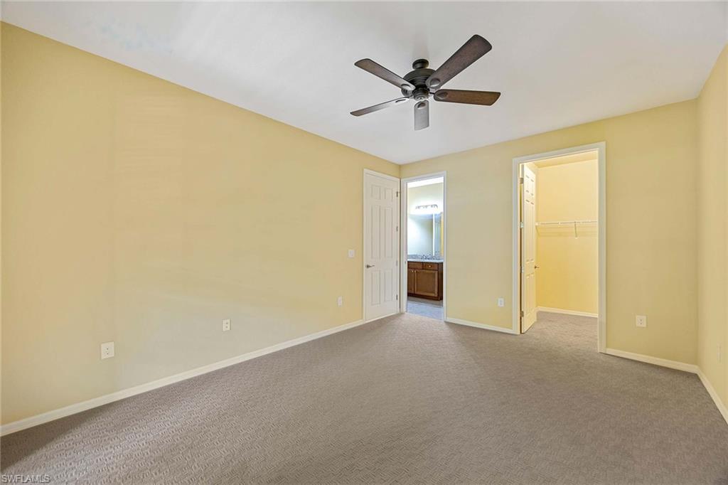 9036 Alturas Street, Unit 3603 Naples, FL 34113 - Photo 12 of 41 a view of an empty room with wooden floor