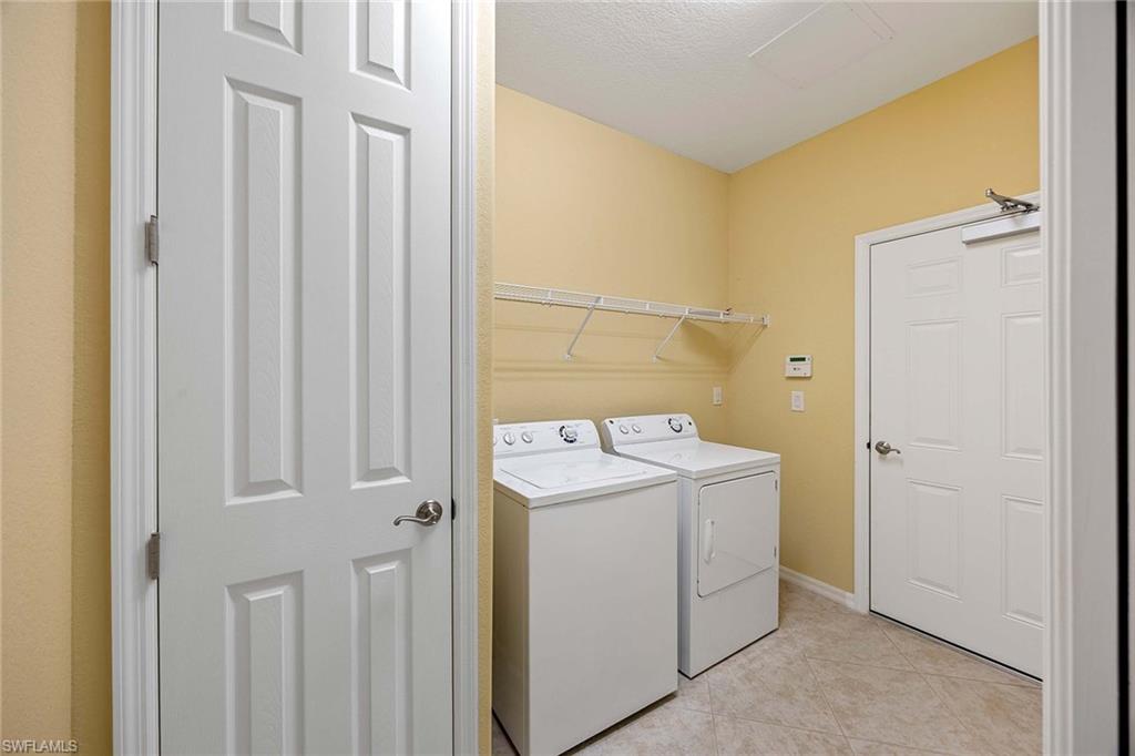 9036 Alturas Street, Unit 3603 Naples, FL 34113 - Photo 14 of 41 a utility room with dryer and washer