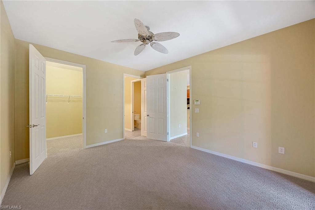 9036 Alturas Street, Unit 3603 Naples, FL 34113 - Photo 15 of 41 a view of an empty room and a ceiling fan