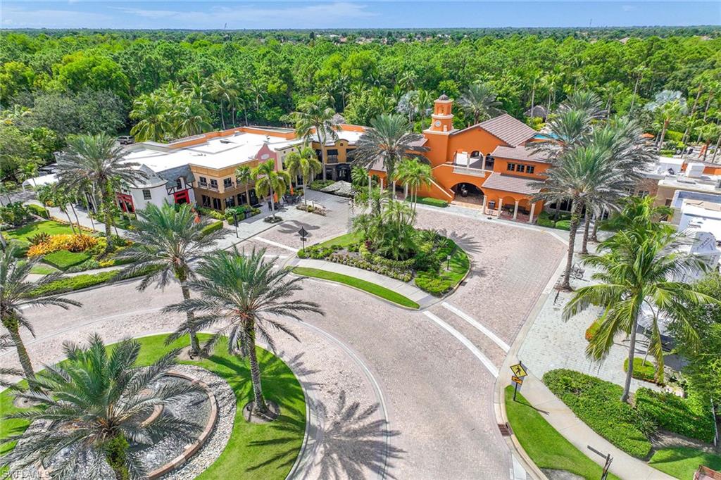 9036 Alturas Street, Unit 3603 Naples, FL 34113 - Photo 23 of 41 an aerial view of a house with a yard outdoor seating and trees