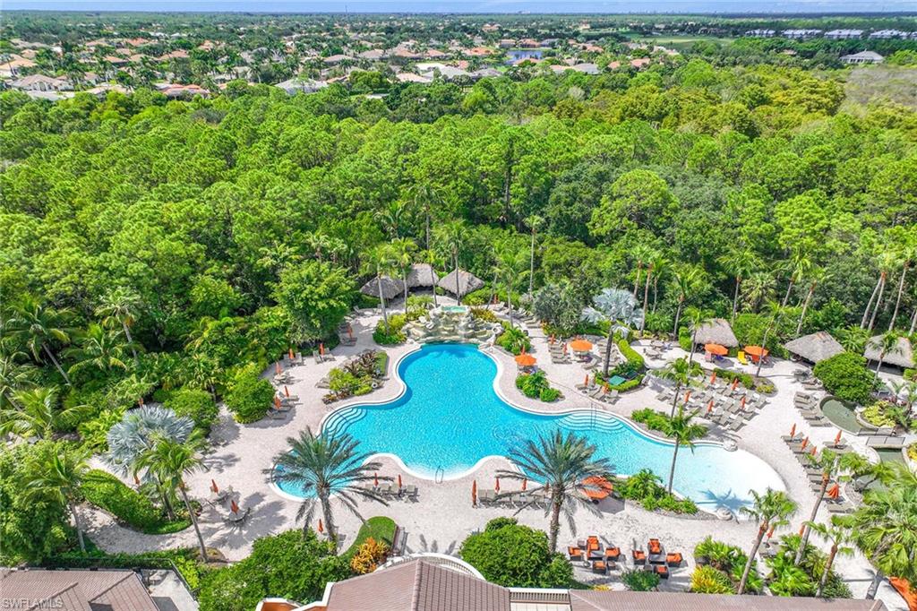 9036 Alturas Street, Unit 3603 Naples, FL 34113 - Photo 24 of 41 an aerial view of a house with a yard and lake view