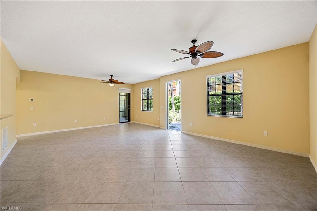 9036 Alturas Street, Unit 3603 Naples, FL 34113 - Photo 4 of 41 wooden floor in an empty room with a window