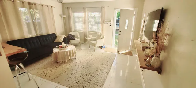 a living room with patio furniture