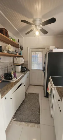 a kitchen with granite countertop a sink stainless steel appliances and cabinets