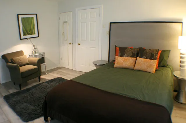 a bedroom with a bed and couch