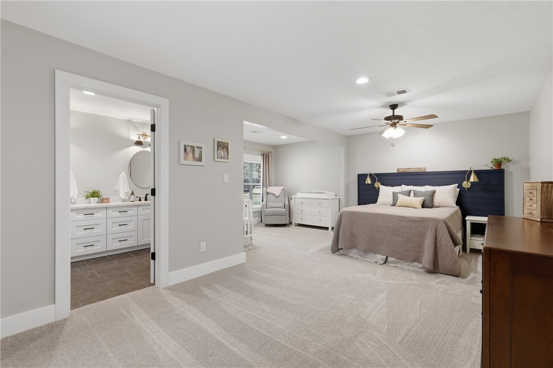 515 Crescent Drive Bryan, TX 77801 - Photo 17 of 43 Spacious primary room featuring light gray carpeting, recessed lighting, and a ceiling fan
